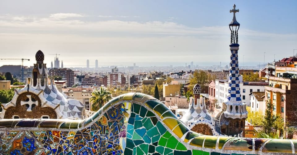 A street scene in Barcelona's Poble-sec neighbourhood, showing residential buildings and a public space.