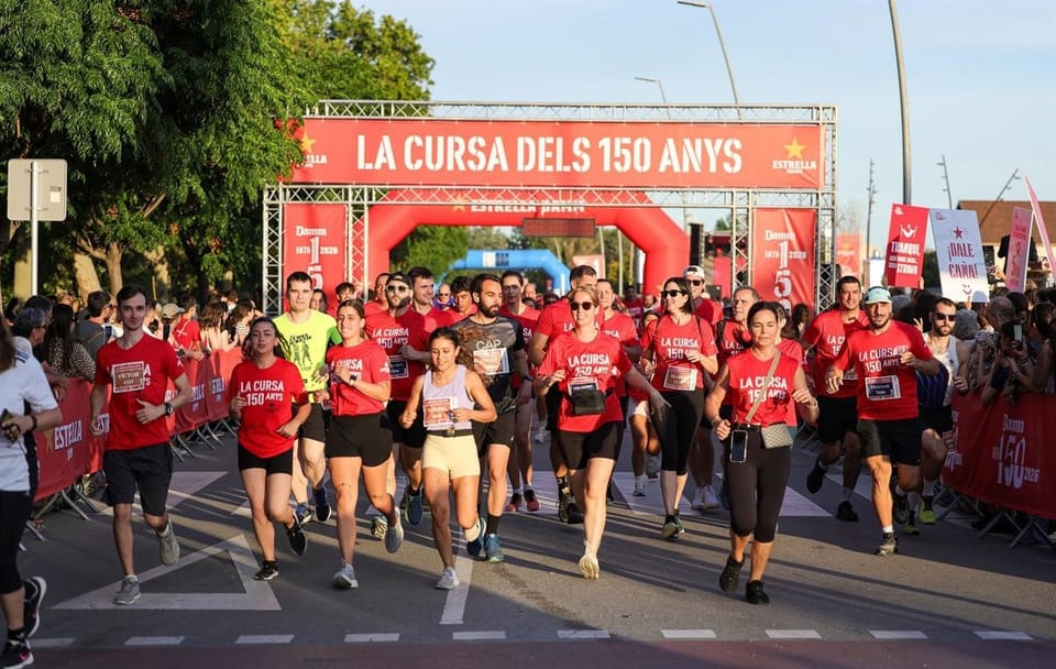 Runners participating in the Estrella Damm 150th Anniversary Race in El Prat de Llobregat, Barcelona
