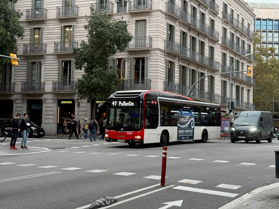 A TMB V29 bus in Barcelona serving the Diagonal Mar to Virrei Amat and Roquetes route during summer beach travel.
