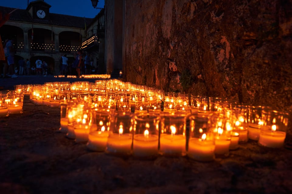 Night view of the Gothic cloister at Monestir de Pedralbes in Barcelona during a summer light and sound event.