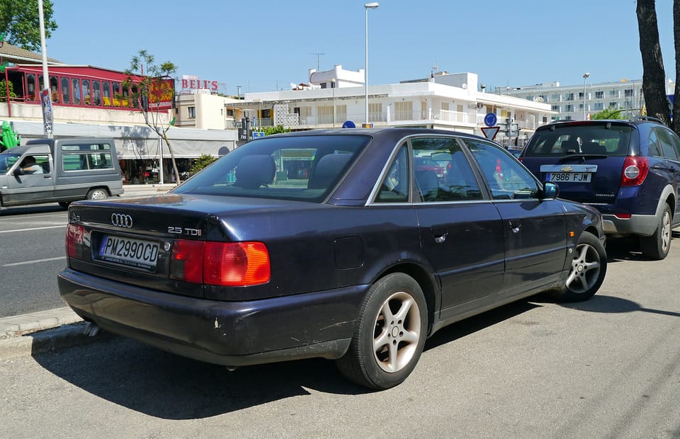 Rows of used cars parked at a dealership in Catalonia as demand rises for older diesel and second-hand electric vehicles.