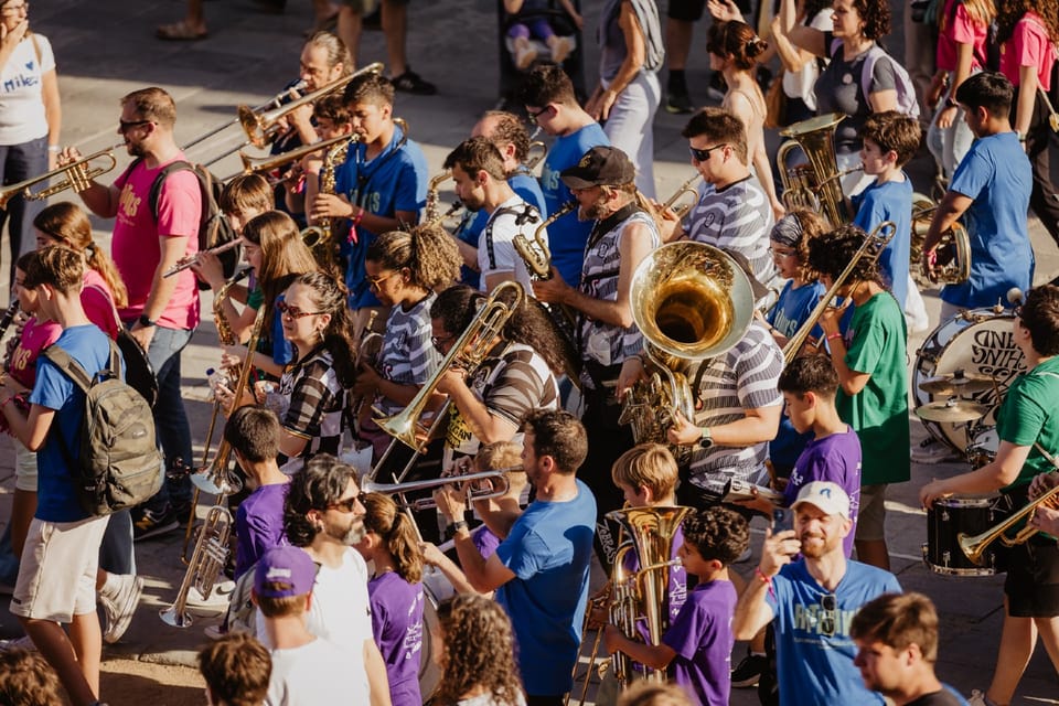 Children and parents attending a music workshop at the Les Garrigues Music School in Catalonia.