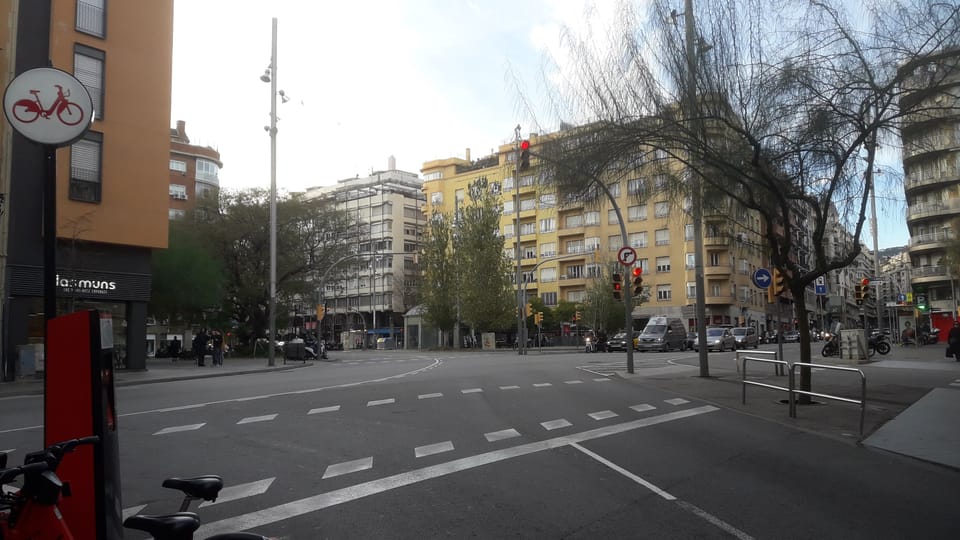 View of the newly renovated Balmes Street in Barcelona, showing widened pavements, new trees, and updated street furniture between Plaça de Molina and Ronda del General Mitre.