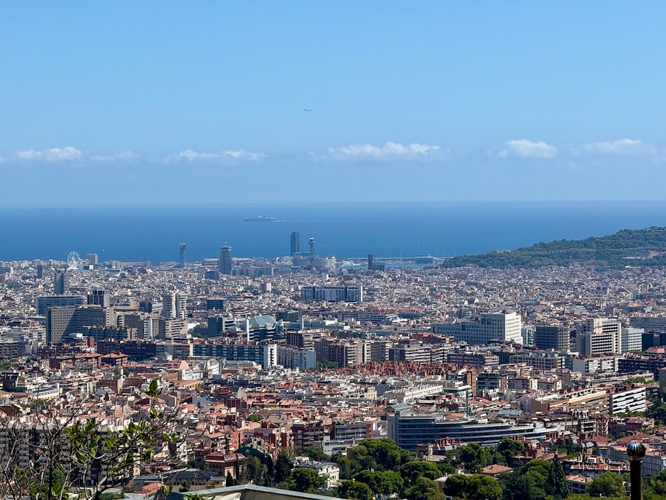 A cloudy sky over Barcelona during August weather conditions.