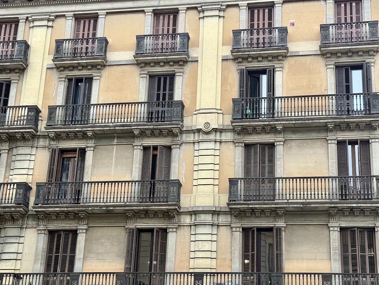 Residential apartment buildings in Catalonia, illustrating the dispute over proposed restrictions on speculative home purchases.