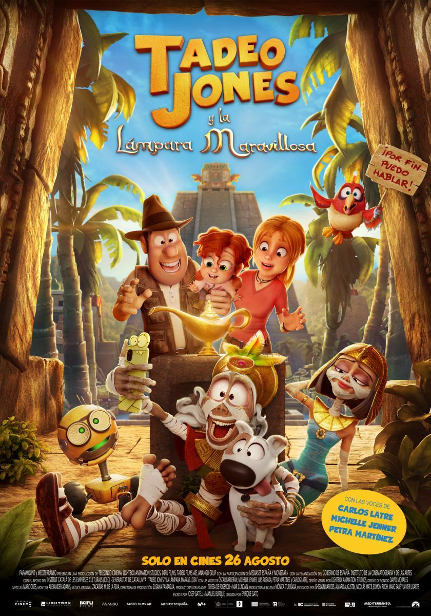 Poster for 'Tadeu Jones 4: La llàntia meravellosa' displayed in a Barcelona cinema lobby with families viewing it.