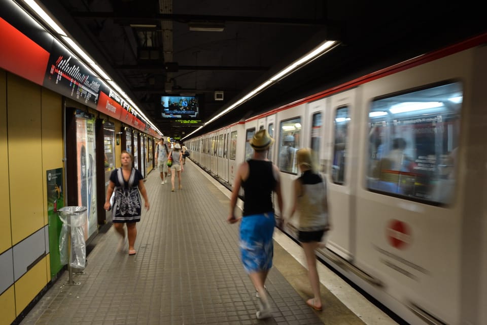 Passengers walk through the concourse at Passeig de Gràcia Metro station in central Barcelona during La Mercè.