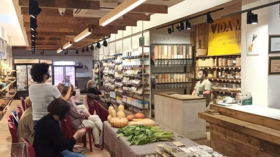 Independent local shops on a Barcelona street, representing businesses that may participate in the Bonus Consum voucher scheme.