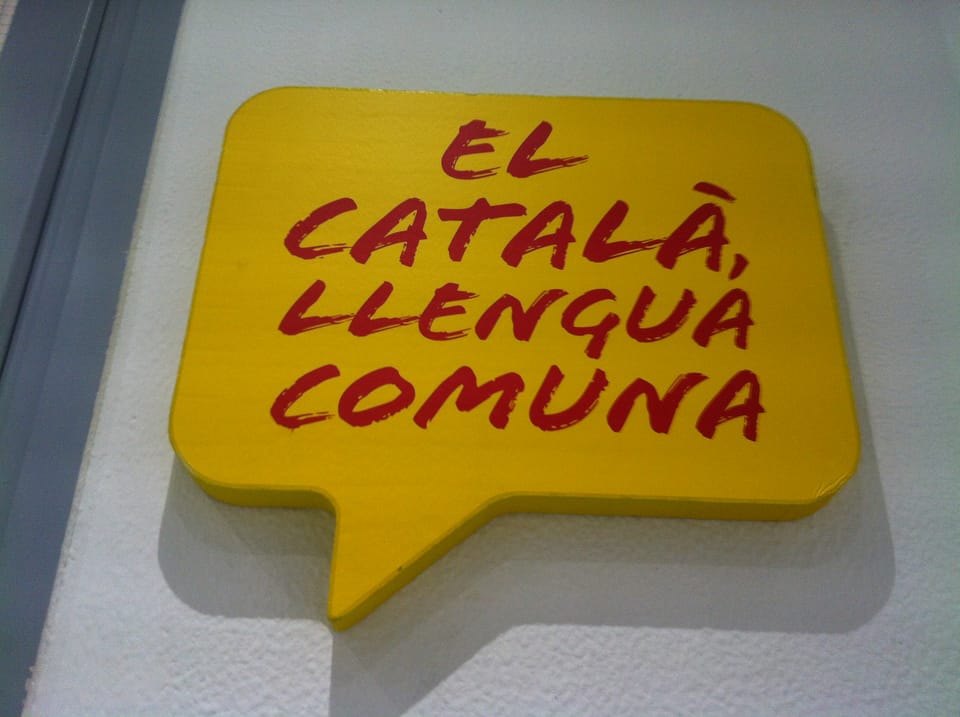 People walk along a street in Barcelona, where an unpublished municipal survey reports changes in habitual language use.