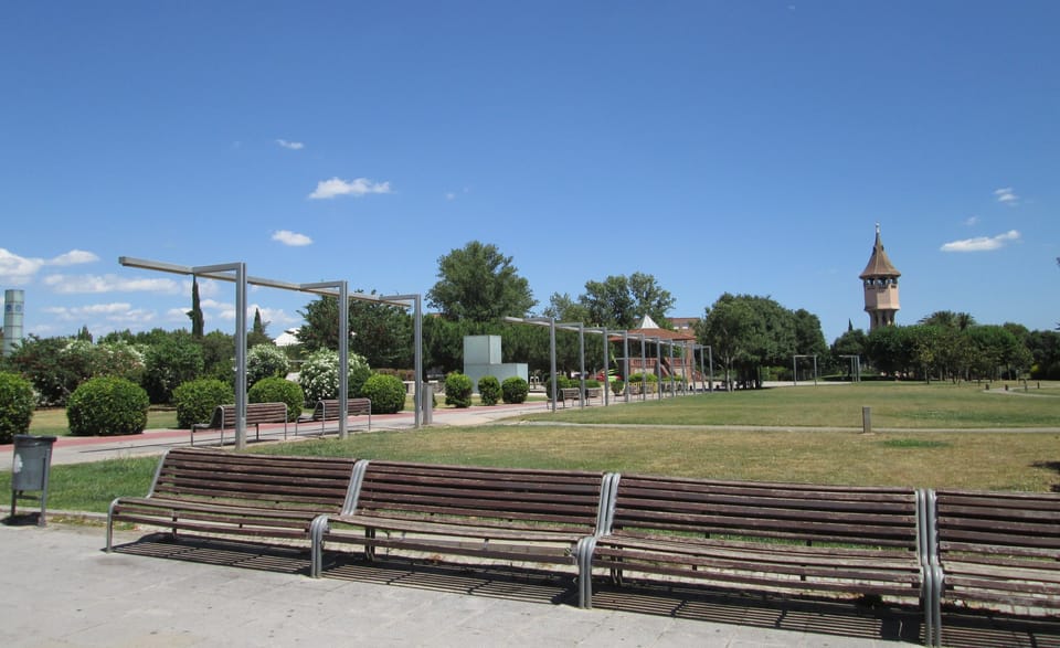 Aerial view of a public square in Sabadell with children's play equipment, greenery and seating, ahead of renovation works.