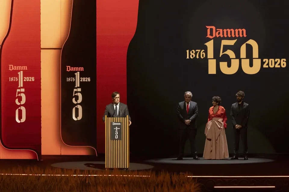 Guests attending Damm's 150th anniversary gala at the Gran Teatre del Liceu in Barcelona, with a stage performance in the bac
