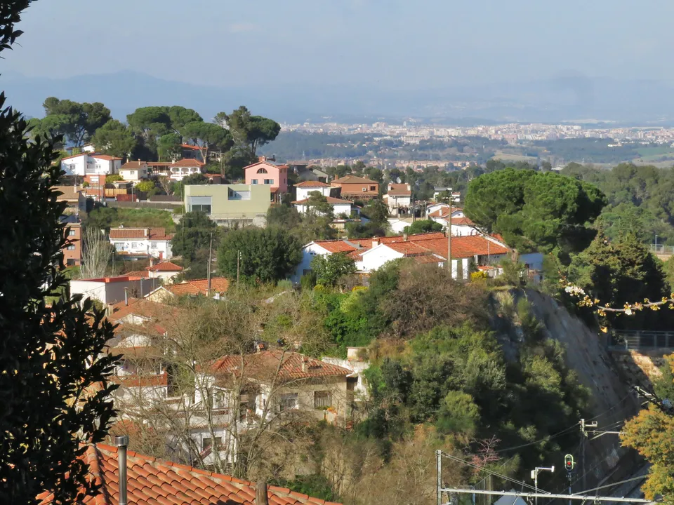 An industrial building on Passatge de la Salut in La Floresta, Sant Cugat del Vallès, surrounded by residential streets.